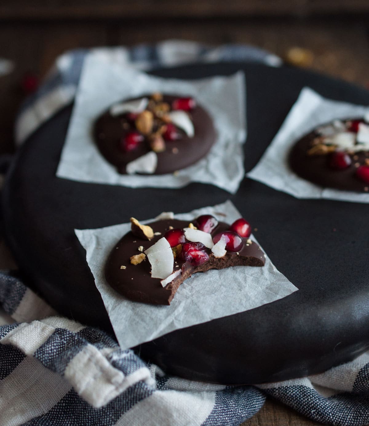Dark chocolate pomegranate bites are a simple tasty treat to eat or give as Christmas gifts. Made to satisfy a sweet tooth for under 100 calories! 