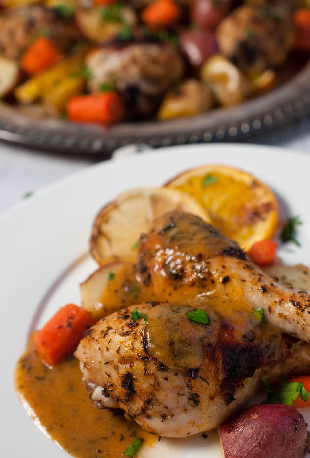 Baked citrus chicken and vegetables is a comforting, delicious, unique one dish meal that is impressive enough to serve to guests without being too fussy.