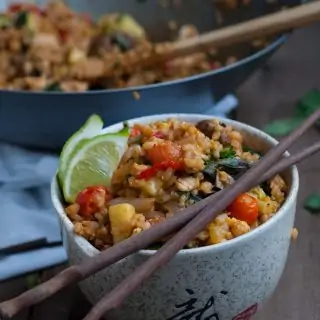 Thai fried brown rice that's loaded with veggies to lighten up without loosing any of the tasty flavor and spice that we all love and crave.