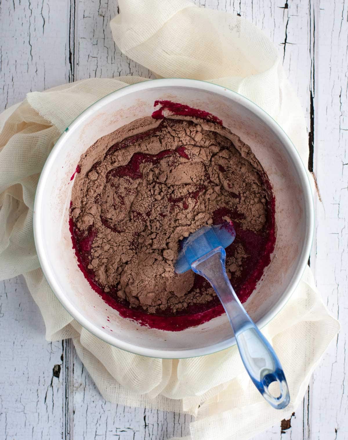 Healthy yet tasty beet red velvet cupcakes are made with whole wheat flour and no processed sugar. They're topped off with a decadent cream cheese frosting.