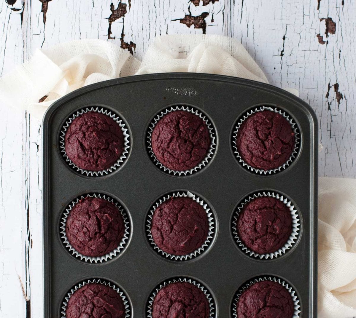 Healthy yet tasty beet red velvet cupcakes are made with whole wheat flour and no processed sugar. They're topped off with a decadent cream cheese frosting.