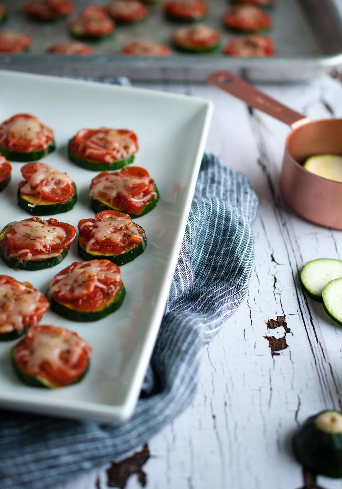 Zucchini pizza bites are the perfect snack for game day or any other time you need a healthy appetizer that is simple and easy to make, but full of flavor.