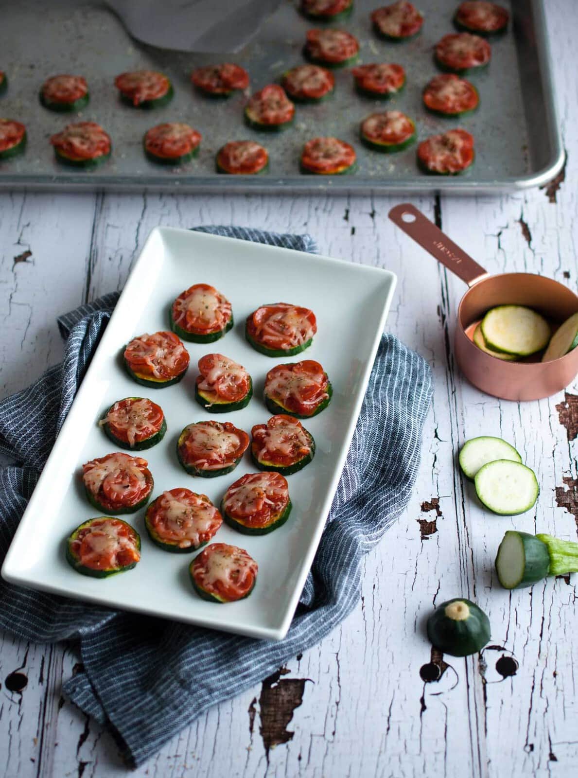 Zucchini pizza bites are the perfect snack for game day or any other time you need a healthy appetizer that is simple and easy to make, but full of flavor.