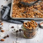 Crunchy chocolate coconut granola with toasty almonds, coconut oil, honey, and a dash of cinnamon to make your breakfast the best meal of the day.