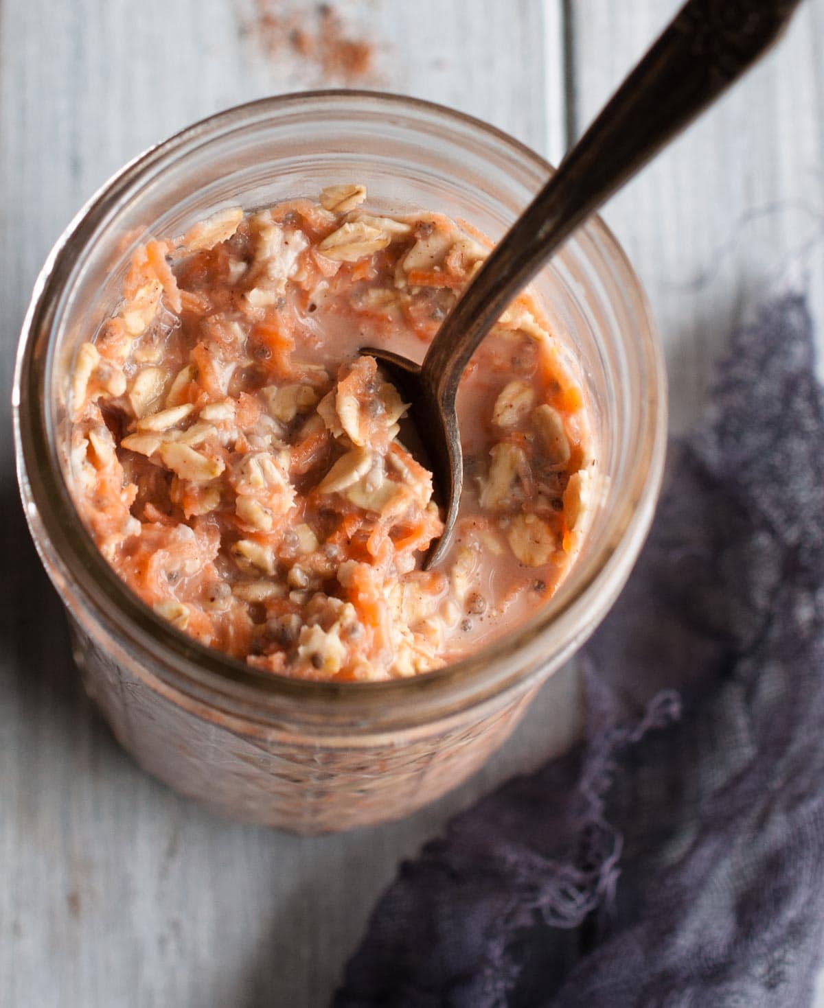 Carrot cake overnight oats are a healthy 350 calorie breakfast that tastes just enough like the favorite dessert to make breakfast seem like a treat. 