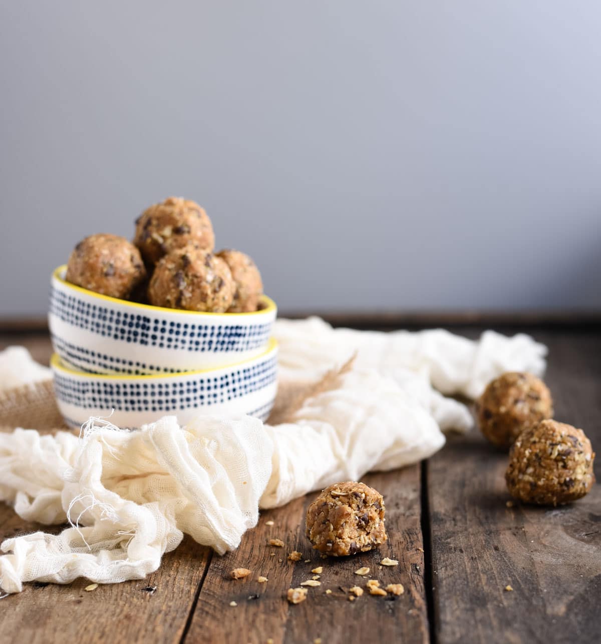 Peanut butter energy balls side shot with a bite