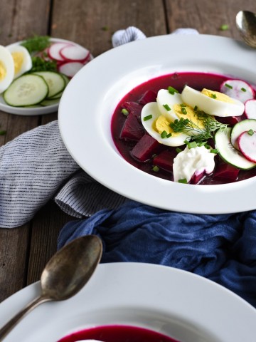 cold borscht with sour cream, boiled egg, and dill