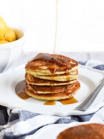 syrup drizzled over Lemon poppy seed pancakes photo