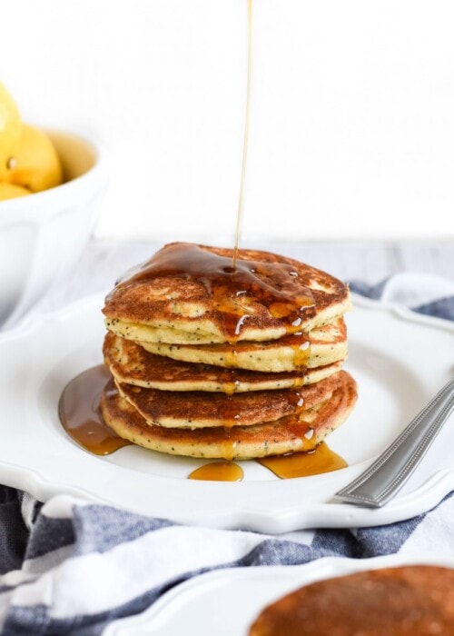 syrup drizzled over Lemon poppy seed pancakes photo