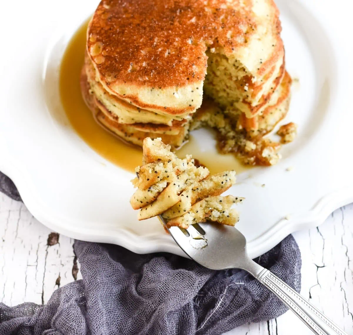 Picture of poppy seed pancakes with bite on fork