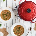 overhead picture of chicken paprika soup and le creuset pot