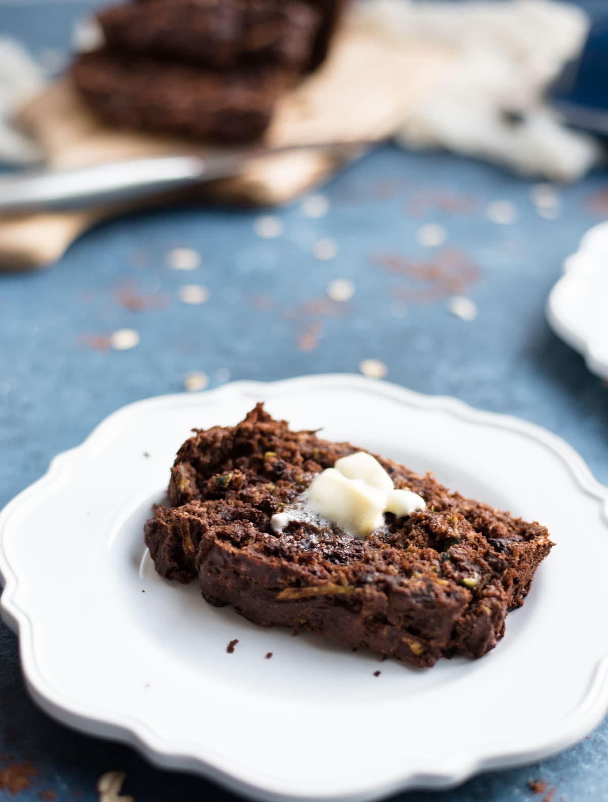 chocolate zucchini banana bread close up with butter