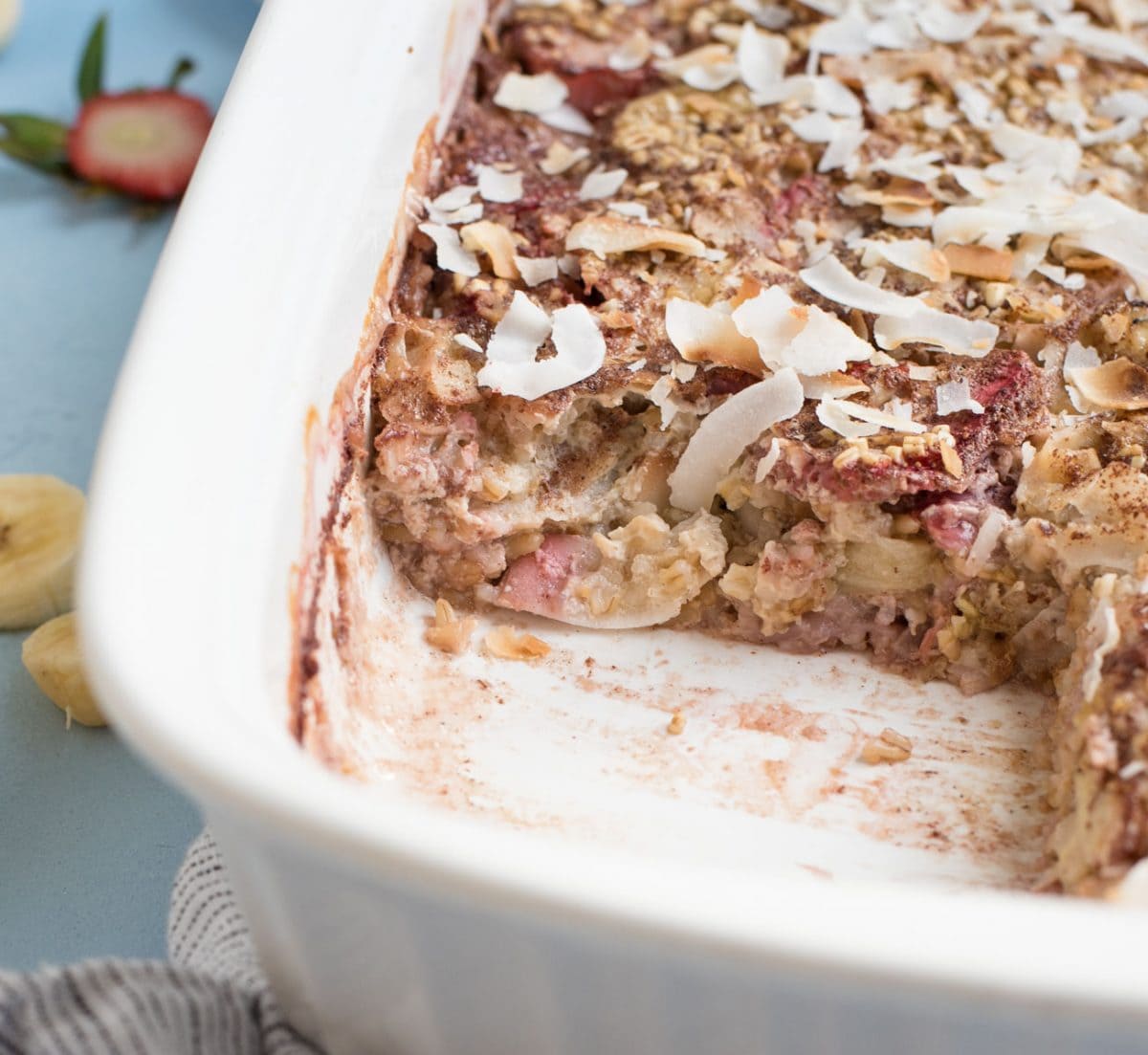 Strawberry Banana Steel Cut Oat Bake in the pan with piece taken out