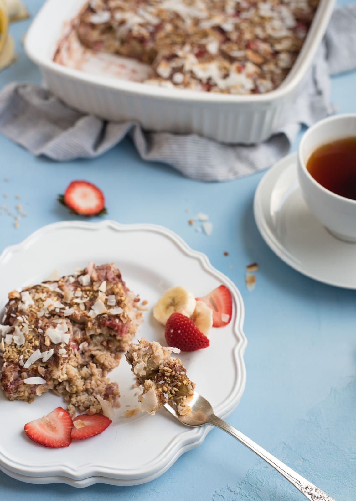 Strawberry banana steel cut oat bake breakfast plate with bite