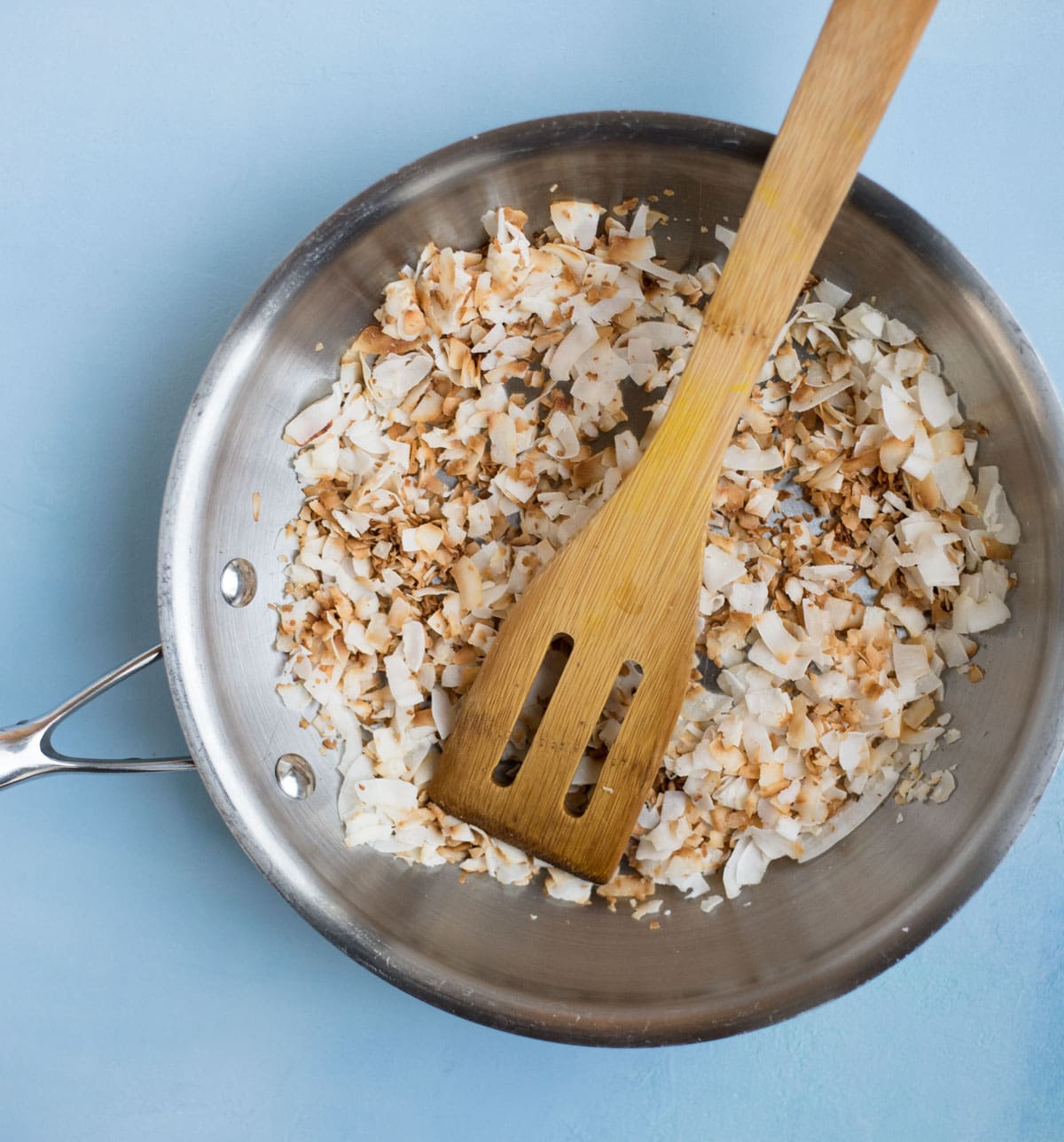 Strawberry Banana Steel Cut Oat Bake toasted coconut in a pan