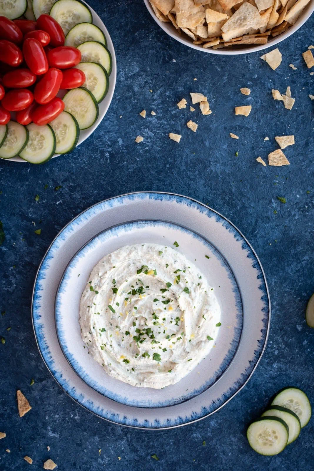 Photo of whipped feta with herbs on blue serving bowl