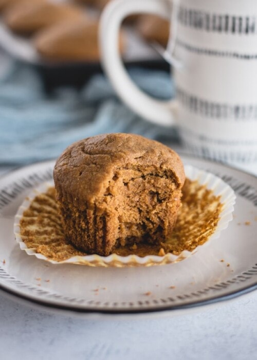 close up picture of healthy pumpkin muffin with bite taken out