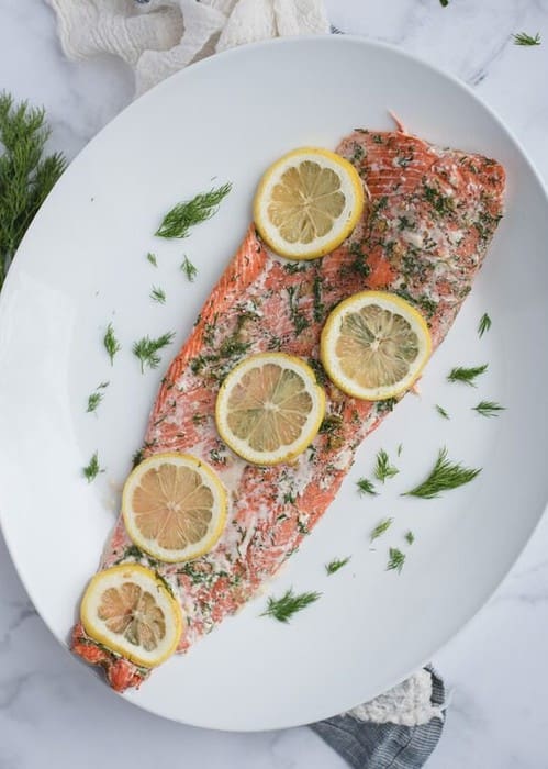 Overhead picture of oven baked salmon with lemon and dill