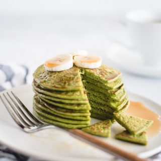 close up picture of stack of green spinach pancakes