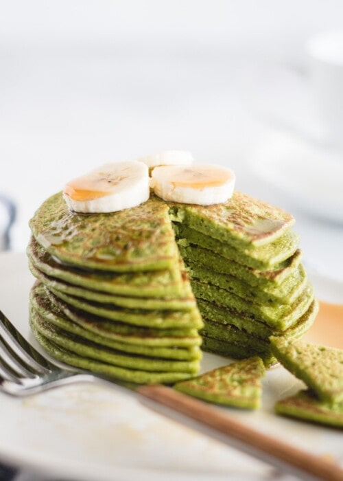 close up picture of stack of green spinach pancakes