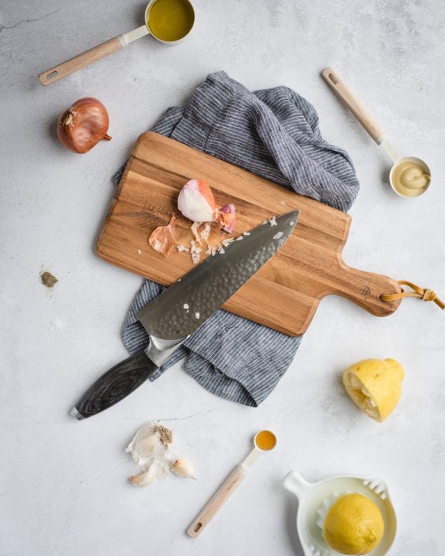 overhead pic of shallot on a cutting board with other ingredients around it