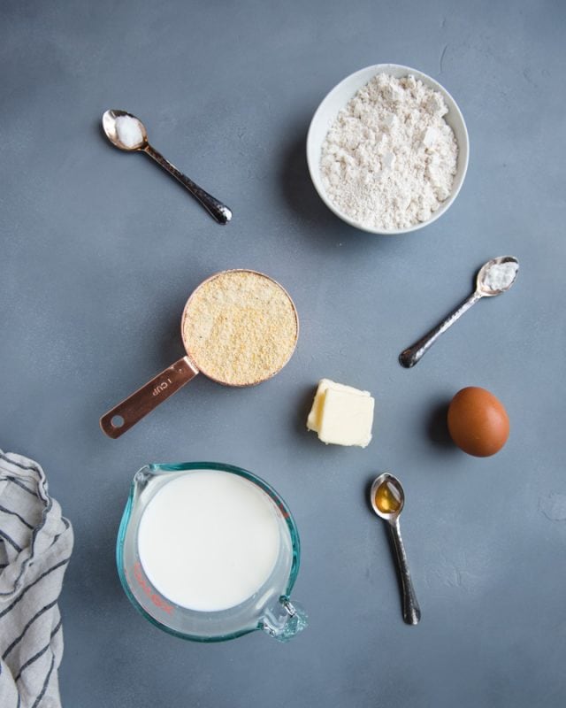 overhead picture of whole wheat cornbread ingredients on a gray background