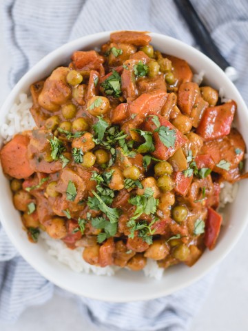 bowl of vegan chickpea curry on white background
