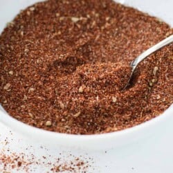 Close up picture of chicken taco seasoning blend in a white bowl