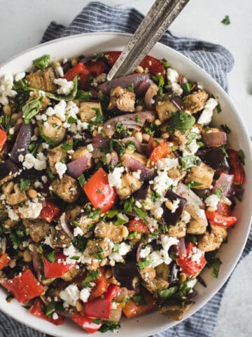 overhead picture of Mediterranean eggplant salad in a white bowl