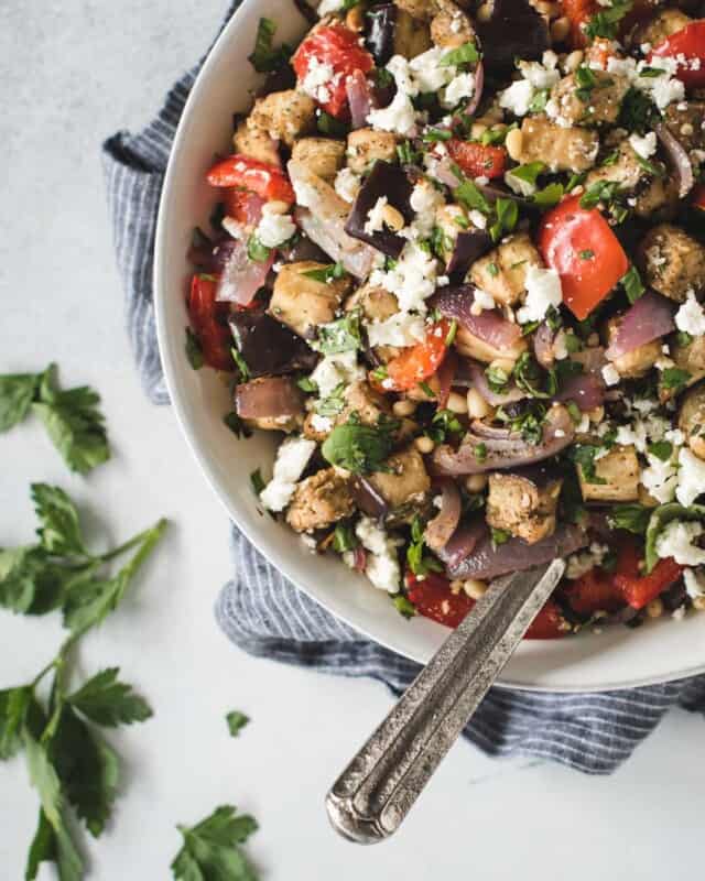 Overhead picture of Mediterranean eggplant salad tossed with feta, herbs, pine nuts and lemon