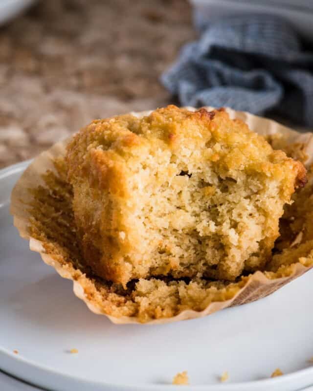 Close up picture of coconut muffin with bite taken out