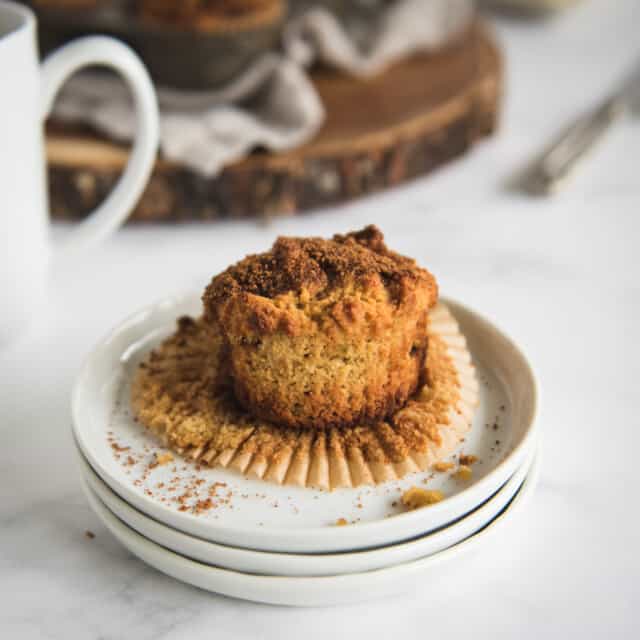 close up square picture of a coffee cake muffin  on a plate