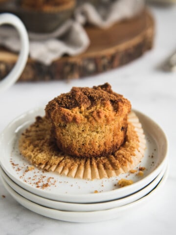 coffee cake muffin on a white plate with white background