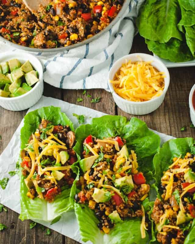picture of three taco lettuce wraps on a wood backdrop