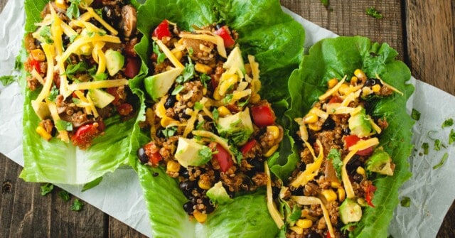 landscape picture of three taco lettuce wraps with corn, black beans and quinoa