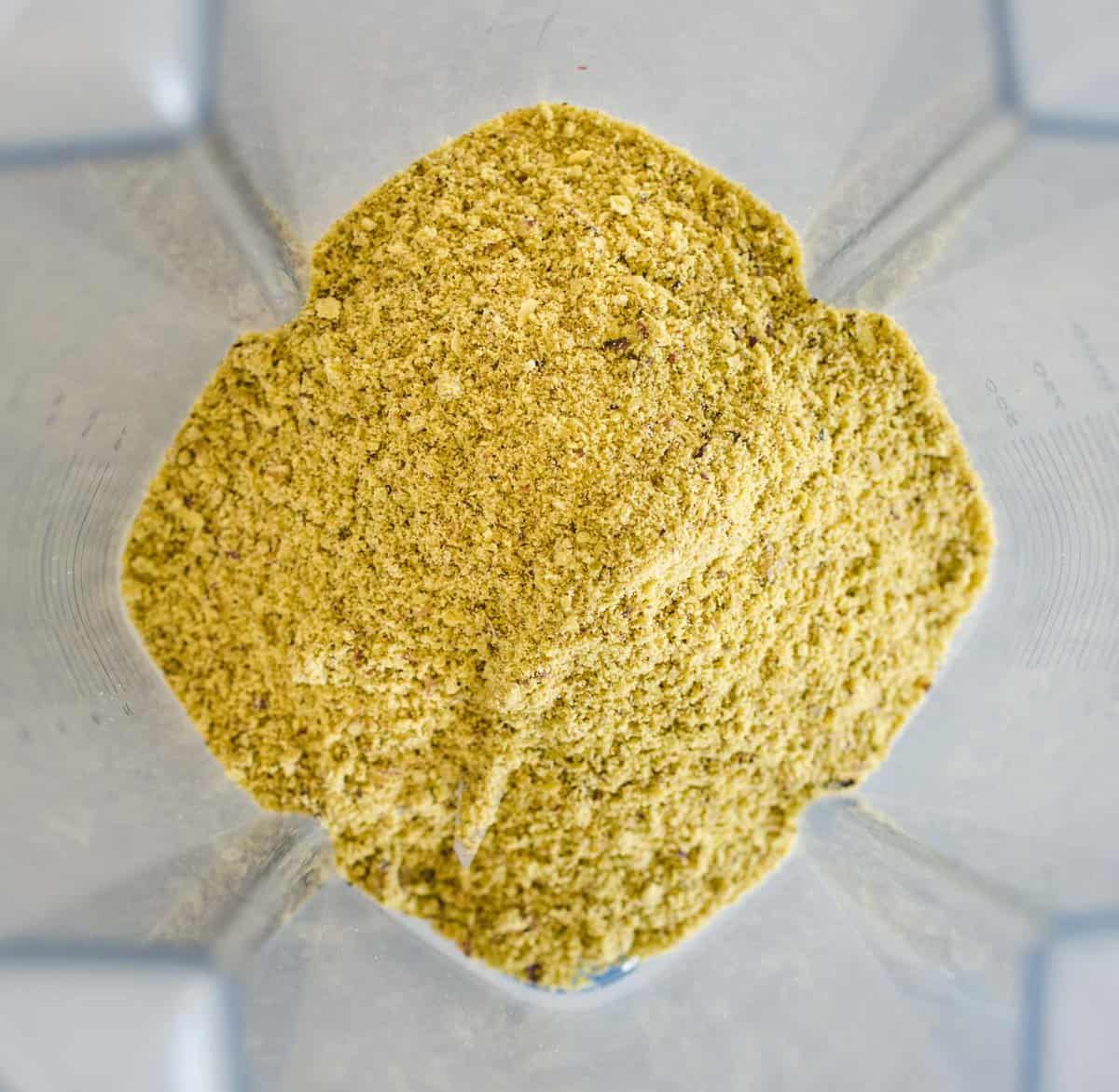 overhead shot of pistachio flour in a blender