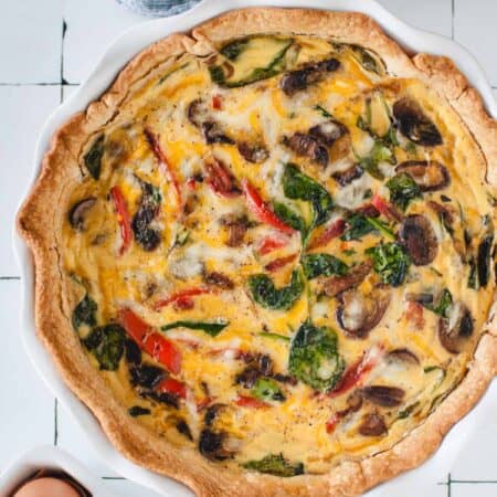 overhead picture of a quiche on a white background