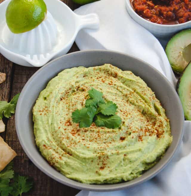 avocado hummus dip in a gray bowl