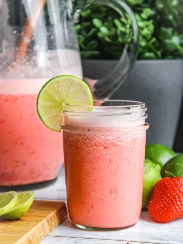 pink drink in a mason jar with lime wedge