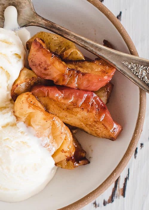 close up image of air fried sliced apples with ice cream in bowl