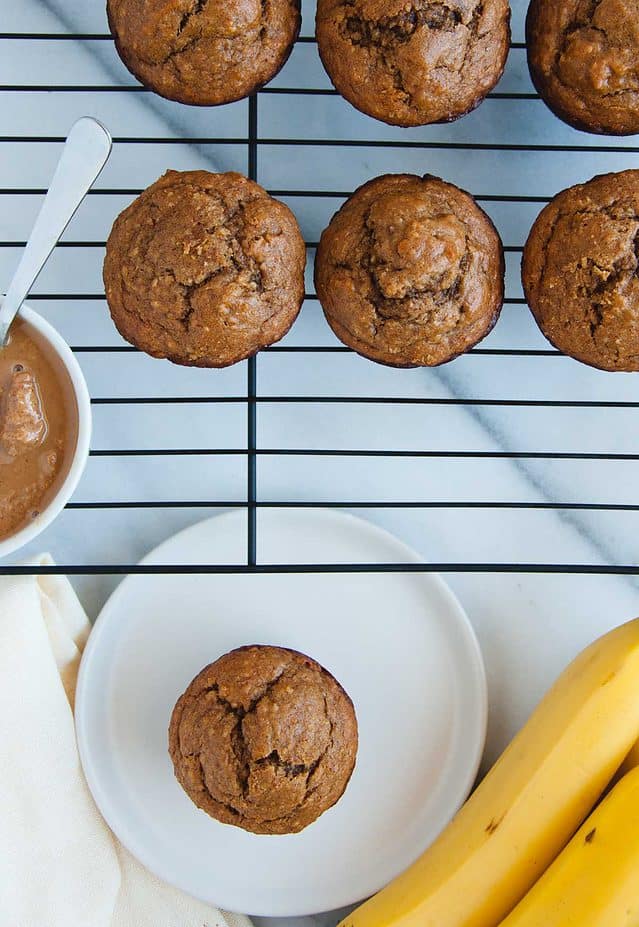 vertical overhead of peanut butter banana muffins and bananas