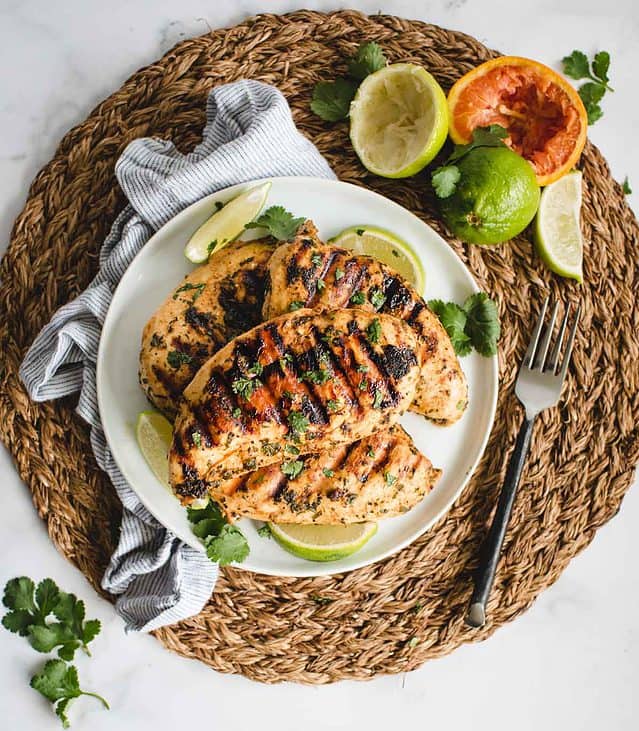 overhead of grilled marinated Mexican chicken on a plate