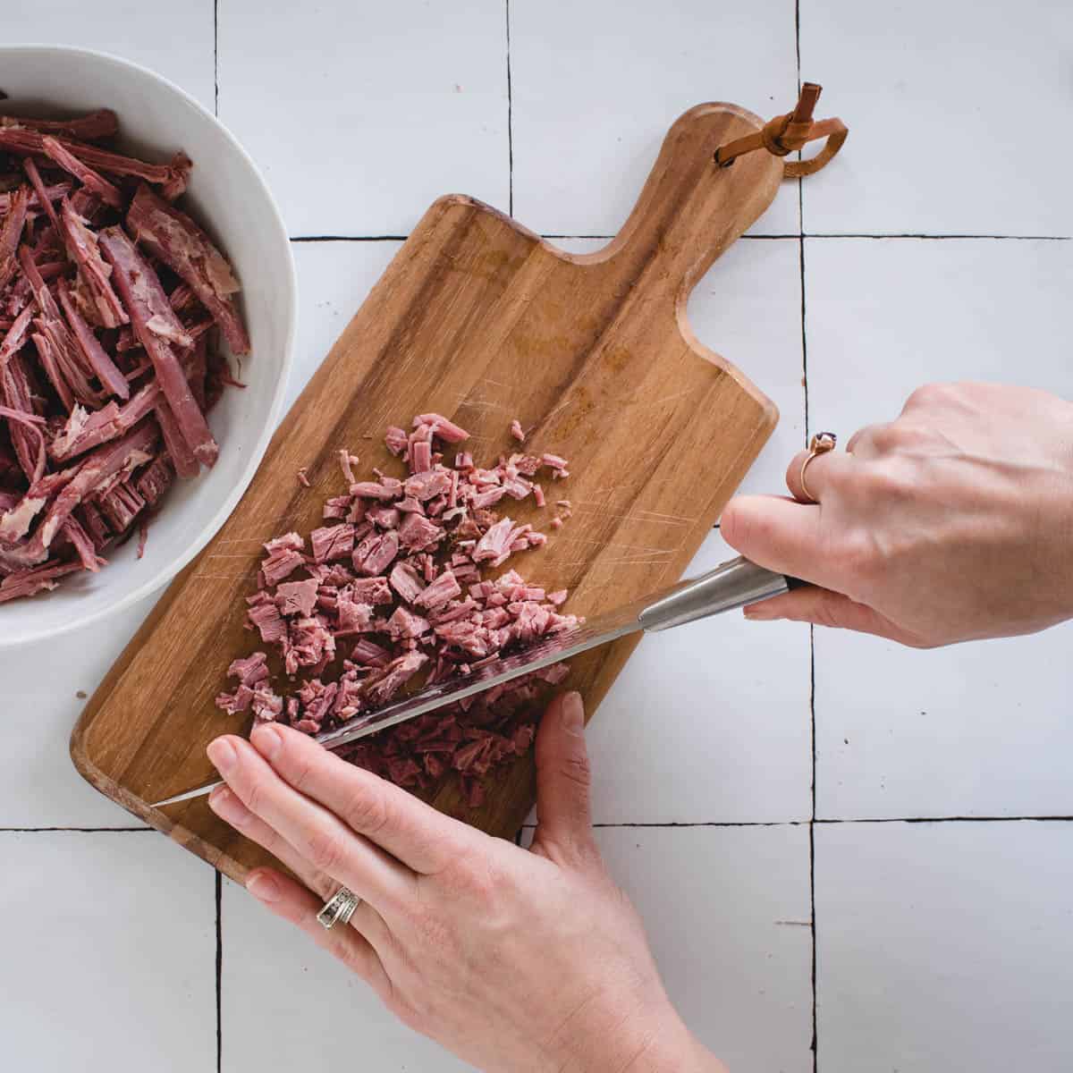 Corned beef being chopped into pieces