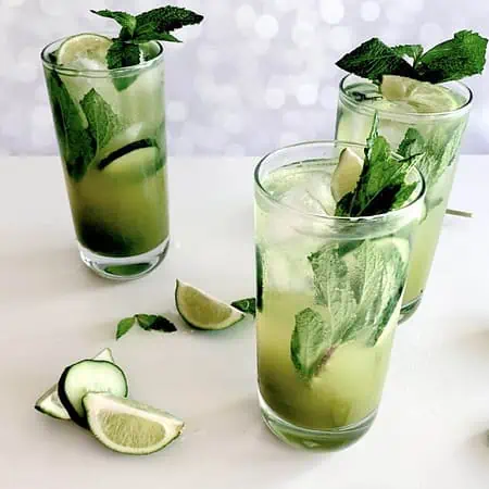Drink in a tall glass with mint and cucumber