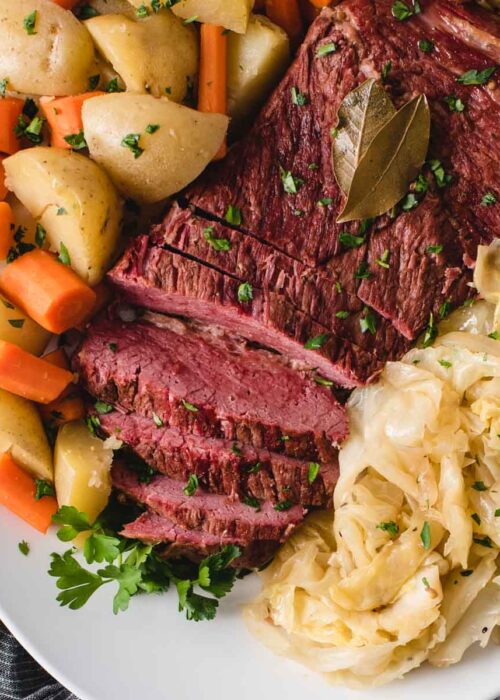 square picture of corned beef and cabbage on a serving platter