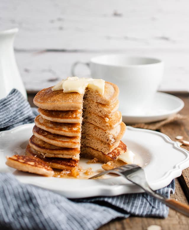 stack of pancakes with wedge taken out