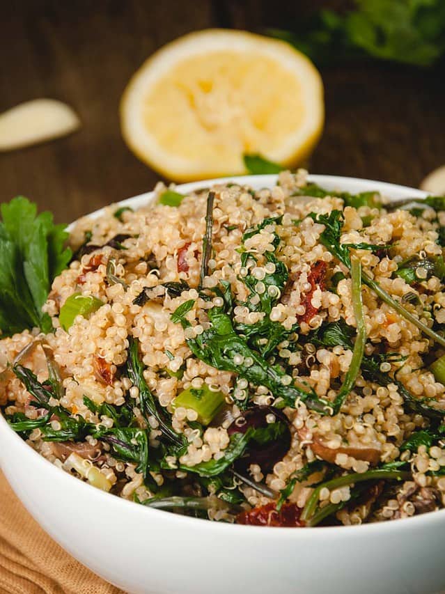 quinoa salad with asparagus and lemon in background