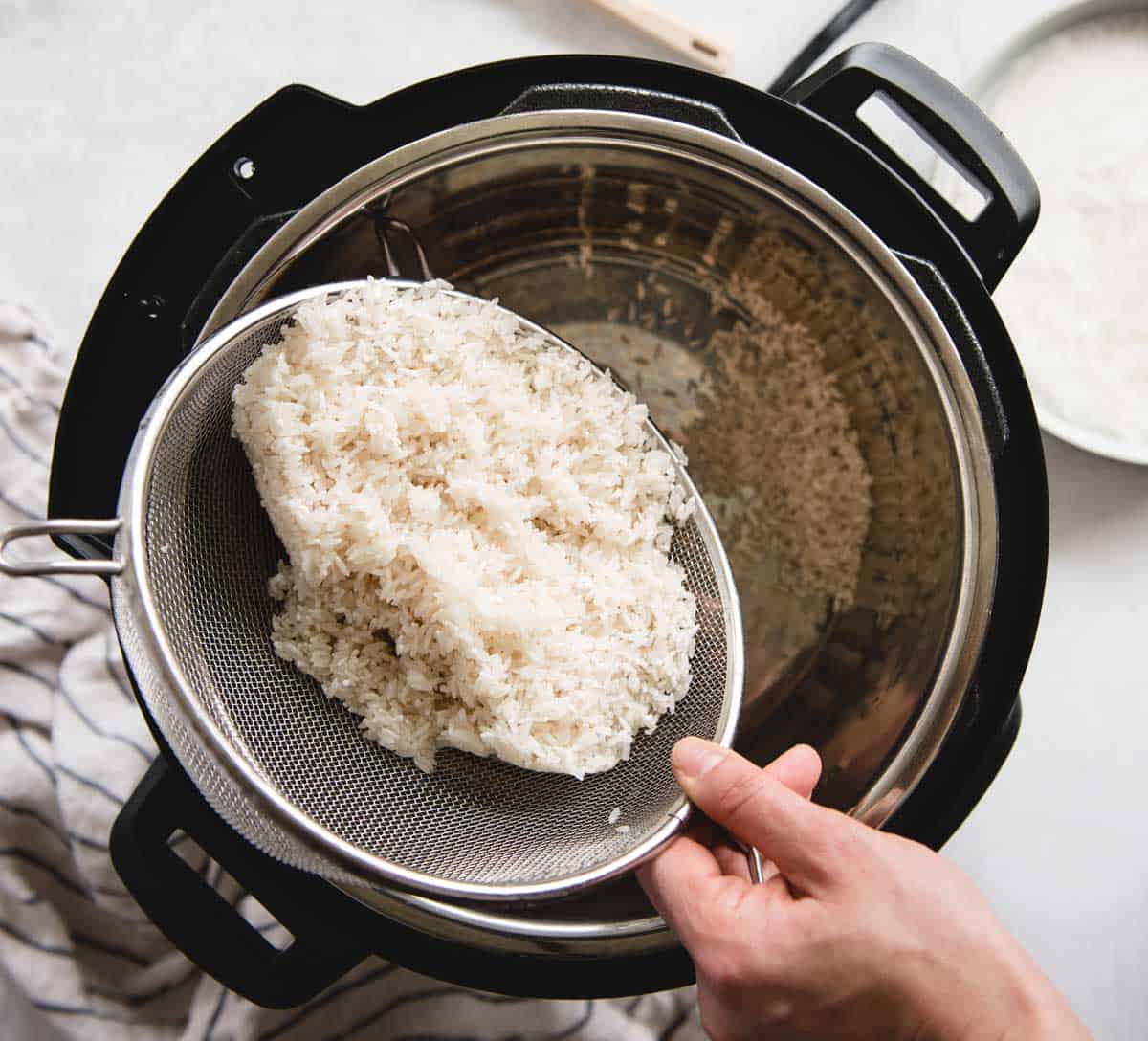 rice being dumped into an instant pot