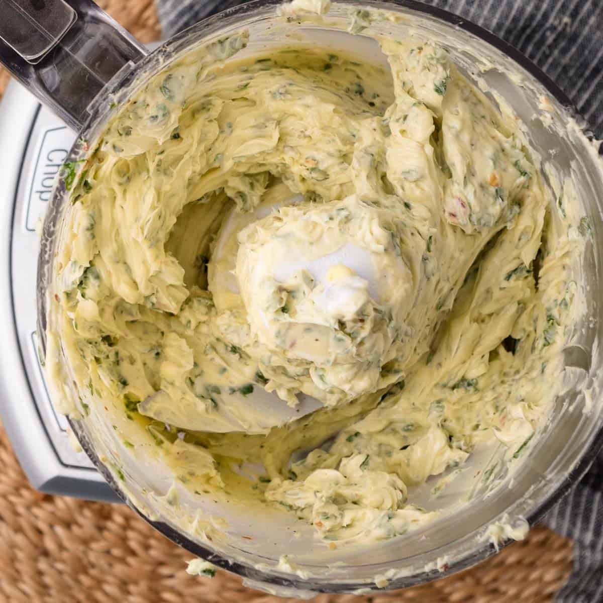 butter and herbs blended from overhead in a food processor